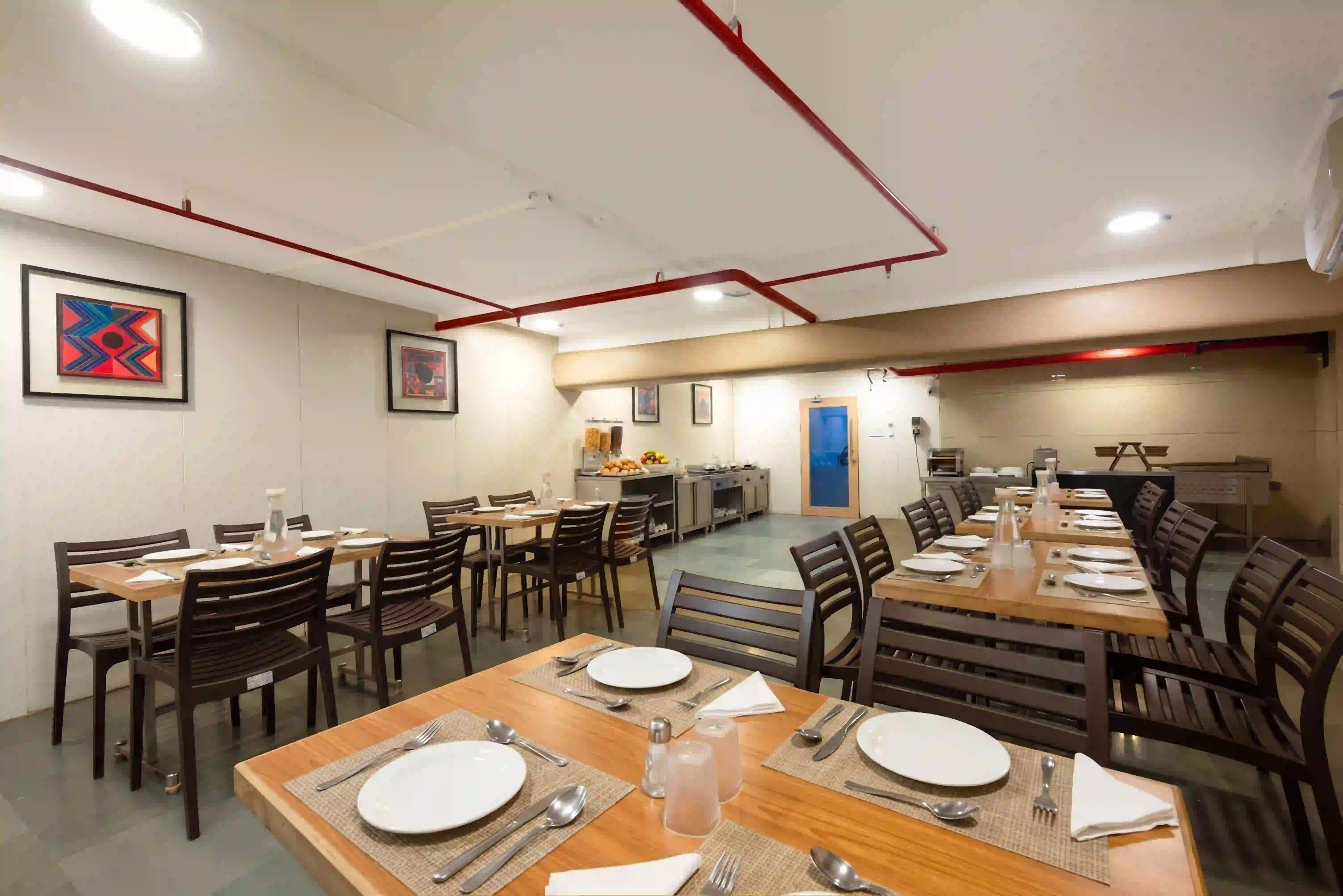 Dining tables at Hotel Supreme Comforts